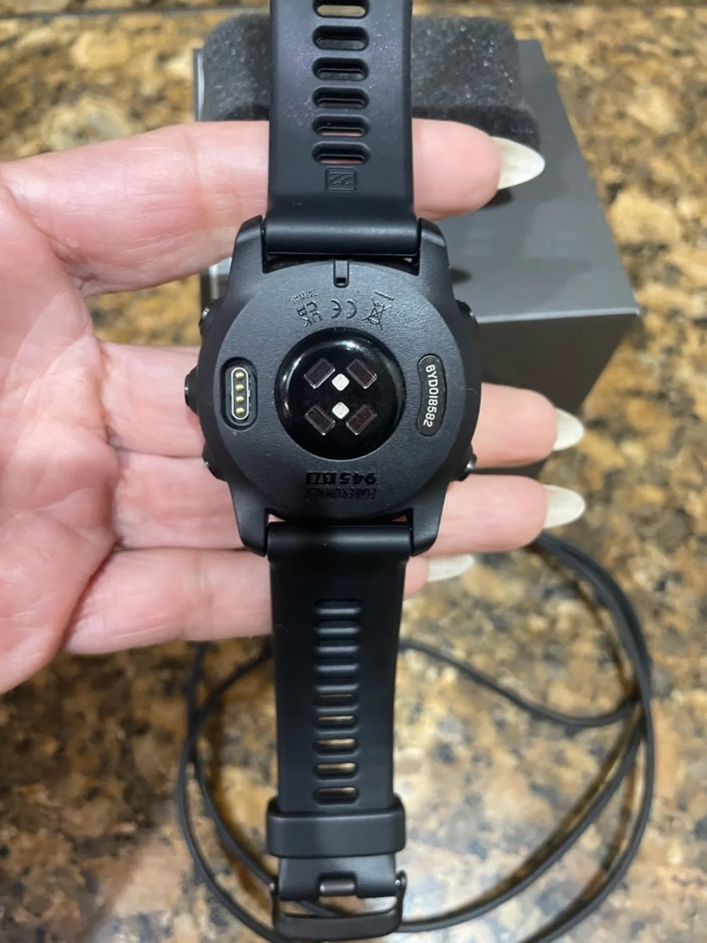 garmin black sports GPS smartwatch with black silicone band